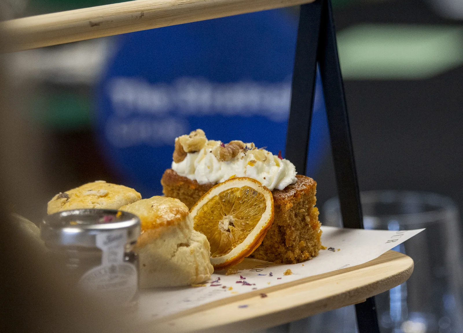 Beautifully plated afternoon tea cakes and scones at a Strategic Circle gathering
