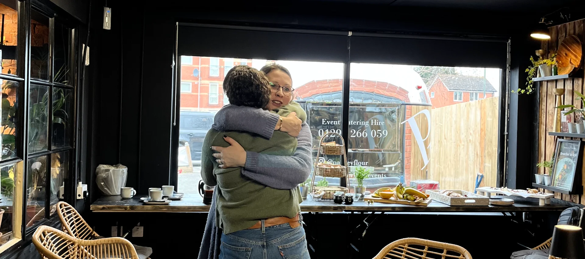 Two members embracing in a warm hug at a Strategic Circle gathering